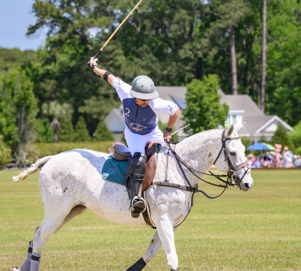 Polo players competing for position at the Rose Hill Charity Polo Match in Bluffton, SC