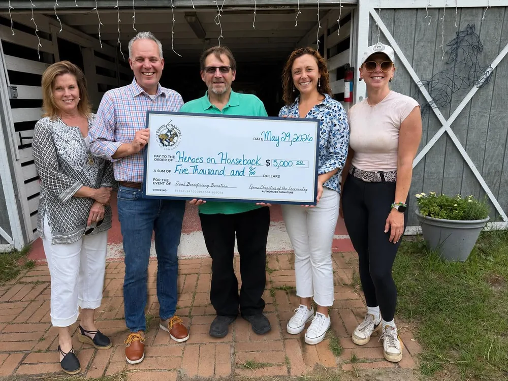 Equus Charities of the Lowcountry presenting a $5,000 donation check to Heroes on Horseback